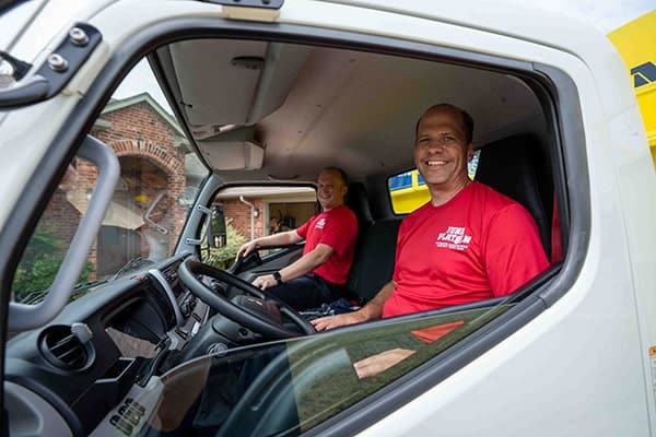 Junk removal experts sitting in their truck